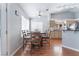 Open dining room area with views of the kitchen, stainless appliances, and plenty of light at 1010 Armillaria St, Henderson, NV 89011