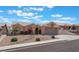 Charming single-story home featuring desert landscaping, a tile roof, and an attached two-car garage at 1010 Armillaria St, Henderson, NV 89011