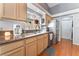 Bright kitchen featuring granite countertops, stainless steel appliances, and wood floors at 1010 Armillaria St, Henderson, NV 89011