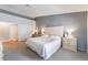 Spacious main bedroom with neutral color scheme, carpet flooring, and ensuite bathroom at 1010 Armillaria St, Henderson, NV 89011