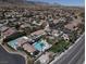 This aerial view showcases the property with pools and a manicured yard at 10200 Clark Wooldridge Ct, Las Vegas, NV 89129