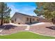 The backyard features low maintenance desert landscaping and concrete walkways at 10200 Clark Wooldridge Ct, Las Vegas, NV 89129