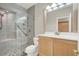 This bathroom features a glass shower with a built-in seat, vanity and brushed nickel fixtures at 10200 Clark Wooldridge Ct, Las Vegas, NV 89129