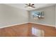 The bedroom offers a window, ceiling fan, and hardwood floors at 10200 Clark Wooldridge Ct, Las Vegas, NV 89129