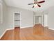 Spacious bedroom featuring hardwood flooring, large closet, and neutral paint at 10200 Clark Wooldridge Ct, Las Vegas, NV 89129