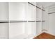 Spacious walk-in closet boasts custom shelving and hardwood flooring at 10200 Clark Wooldridge Ct, Las Vegas, NV 89129