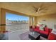 Cozy covered balcony with comfortable seating and scenic views at 1180 Solano Hills Ct, Henderson, NV 89002