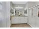 Bright bathroom with dual sinks, granite countertops, and walk-in shower at 1180 Solano Hills Ct, Henderson, NV 89002