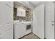 Functional laundry room with washer, dryer, and ample storage space at 1180 Solano Hills Ct, Henderson, NV 89002