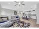 Inviting living room open to the kitchen with stainless steel appliances and a granite island, perfect for gatherings at 1180 Solano Hills Ct, Henderson, NV 89002