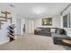 Spacious living room featuring a comfortable sofa, decor, and ample natural light at 1180 Solano Hills Ct, Henderson, NV 89002