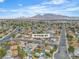 An aerial shot of 14 Page St showcases mountain views and a lush community setting at 14 Page St, Las Vegas, NV 89110