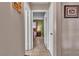 Inviting hallway with neutral walls, tile floors, and an open view to a bedroom creating a warm, welcoming ambiance at 14 Page St, Las Vegas, NV 89110