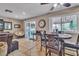 Open-concept living and dining area with access to the backyard patio, filled with natural light at 14 Page St, Las Vegas, NV 89110