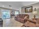 Comfortable living room with tile floors, recessed lighting, and sliding glass doors to the patio at 14 Page St, Las Vegas, NV 89110