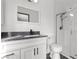 Stylish bathroom featuring a granite vanity, modern fixtures, and a glass-enclosed shower at 1403 Bareback Ct, Henderson, NV 89014