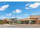The front of community center features many windows for ample light, as well as covered entrance at 1403 Bareback Ct, Henderson, NV 89014
