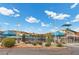 A public pool area has several pools, shade structures, and a small slide at 1403 Bareback Ct, Henderson, NV 89014