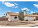 Charming single-story home featuring a well-maintained front yard, two-car garage, and tiled roof at 1403 Bareback Ct, Henderson, NV 89014