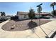 Home with a xeriscaped front yard, a curved window, and a tree in the middle of the yard at 1403 Bareback Ct, Henderson, NV 89014