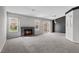 Inviting living room with a brick fireplace, natural light, and sliding glass doors to the backyard at 1403 Bareback Ct, Henderson, NV 89014
