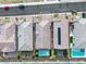 Overhead shot of modern homes, highlighting backyard pools, outdoor living spaces, and meticulously kept landscapes at 154 Nine Mile Creek Dr, Las Vegas, NV 89138