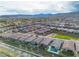Expansive aerial view of a vibrant community with well-maintained homes and stunning mountain views in the background at 154 Nine Mile Creek Dr, Las Vegas, NV 89138