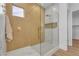 Modern bathroom with white and gold accents, glass shower enclosure, and convenient niche at 154 Nine Mile Creek Dr, Las Vegas, NV 89138