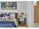 Stylishly furnished bedroom features chic decor, plush bedding and a sleek nightstand at 154 Nine Mile Creek Dr, Las Vegas, NV 89138