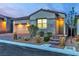 Charming single-story home with a two-car garage, low maintenance landscaping, and brick accents at 154 Nine Mile Creek Dr, Las Vegas, NV 89138