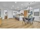 Open kitchen and dining area with stainless steel appliances and hardwood floors at 154 Nine Mile Creek Dr, Las Vegas, NV 89138