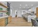 An open-concept kitchen with a large island, stainless steel appliances, and modern light fixtures at 154 Nine Mile Creek Dr, Las Vegas, NV 89138