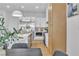 A bright kitchen features white cabinets, stainless steel appliances, and stylish modern pendant lights at 154 Nine Mile Creek Dr, Las Vegas, NV 89138