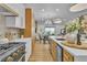 Open concept kitchen with stainless steel appliances, marble countertops, and an adjacent dining area at 154 Nine Mile Creek Dr, Las Vegas, NV 89138