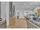 Spacious living area featuring a full wine rack, modern kitchen, and stylish decor at 154 Nine Mile Creek Dr, Las Vegas, NV 89138