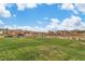 Scenic view of a well-kept lawn, benches, and landscaped area, providing an inviting outdoor space for residents at 154 Nine Mile Creek Dr, Las Vegas, NV 89138