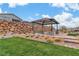 Charming outdoor picnic area with a covered pavilion, picnic tables, and stone accents, ideal for community gatherings at 154 Nine Mile Creek Dr, Las Vegas, NV 89138