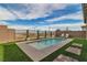 Sparkling pool with lounge chairs surrounded by lush landscaping and privacy fencing at 154 Nine Mile Creek Dr, Las Vegas, NV 89138