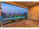 A backyard pool surrounded by brick pavers, a built-in grill, and a view of the surrounding landscape at 154 Nine Mile Creek Dr, Las Vegas, NV 89138