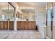 Bright bathroom with double vanity, soaking tub, and separate glass shower at 1633 Broken Feather Dr, North Las Vegas, NV 89031