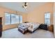Cozy bedroom with high ceilings, a ceiling fan and large window at 1633 Broken Feather Dr, North Las Vegas, NV 89031
