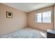 Simple bedroom with neutral walls and bright window at 1633 Broken Feather Dr, North Las Vegas, NV 89031