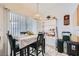 Charming dining area featuring a pendant light fixture with natural light streaming in from a large window at 1633 Broken Feather Dr, North Las Vegas, NV 89031
