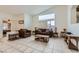 Spacious living room with a large window and a comfortable seating area at 1633 Broken Feather Dr, North Las Vegas, NV 89031