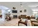 Inviting living room with a fireplace and mantle for decor and TV, next to a cozy rocking chair at 1633 Broken Feather Dr, North Las Vegas, NV 89031