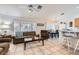 Open-concept living area with a ceiling fan that seamlessly connects to the dining area at 1633 Broken Feather Dr, North Las Vegas, NV 89031