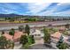 Aerial view of home showing the solar panels, tile roof, pool, and proximity to the freeway at 2073 Sapphire Valley Ave, Henderson, NV 89074