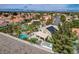 Beautiful aerial view of a desert home showcasing the backyard pool and desert landscape with mountain views in the distance at 2073 Sapphire Valley Ave, Henderson, NV 89074