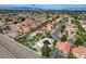 Beautiful neighborhood aerial view of single Gathering homes with many pools, lush landscaping, and curved streets at 2073 Sapphire Valley Ave, Henderson, NV 89074