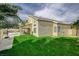 Well-maintained lawn and covered patio provide a relaxing outdoor experience at 2073 Sapphire Valley Ave, Henderson, NV 89074